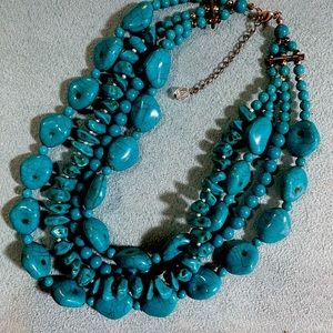 Faux turquoise four strand necklace.